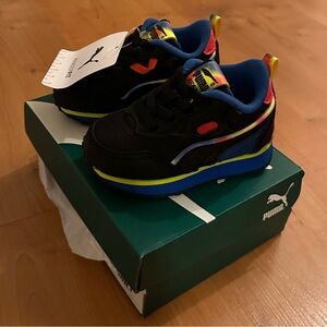 Puma Kids' Black and Blue Sneakers with Neon Accents